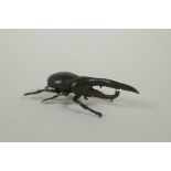 A Japanese style bronze okimono hercules beetle, 7cm