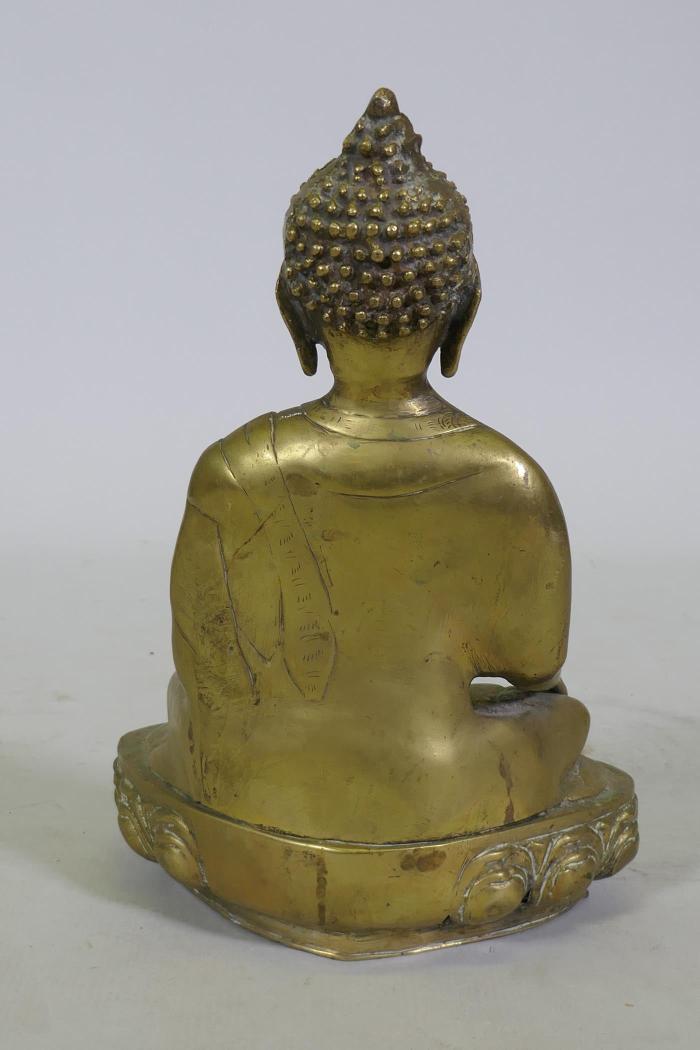 A brass figure of Buddha seated upon a lotus dias, 34cm high - Image 3 of 6