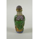 A Peking glass snuff bottle with carved and enamelled decoration of frogs, waterfowl and lotus