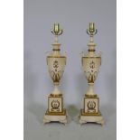 A pair of Empire style painted wood urn shaped table lamps with gilt decoration, 63cm high