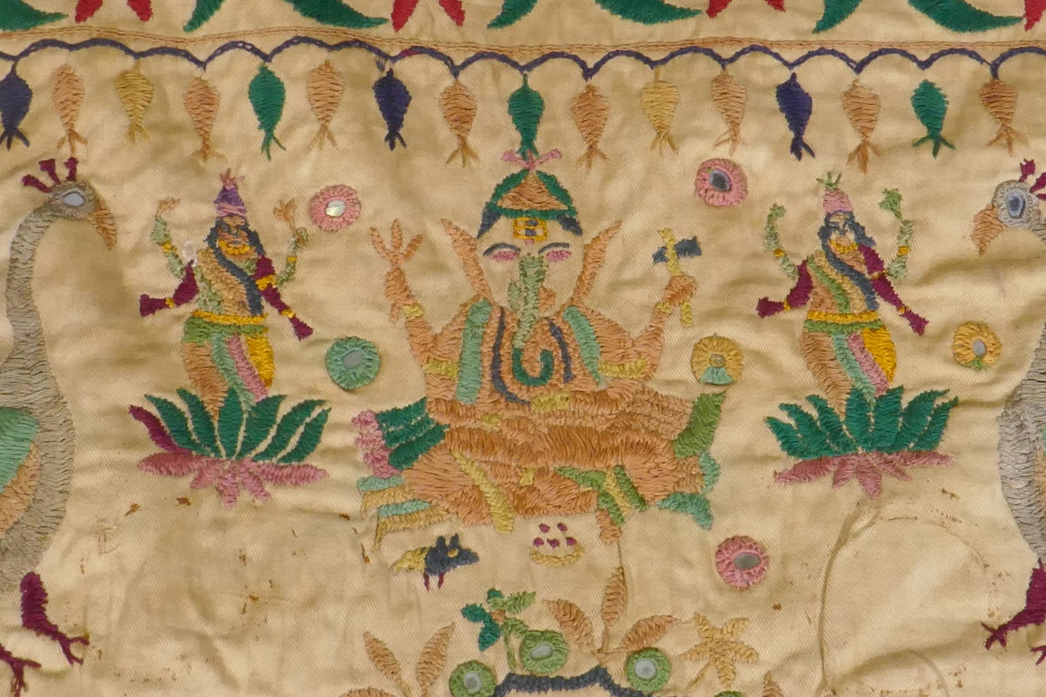 A C19th Indian embroidered wall hanging decorated with depictions of Ganesh, peacocks, elephants, - Image 3 of 9