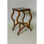 A continental mahogany lamp table, raised on shaped supports, 35 x 38 x 67cm