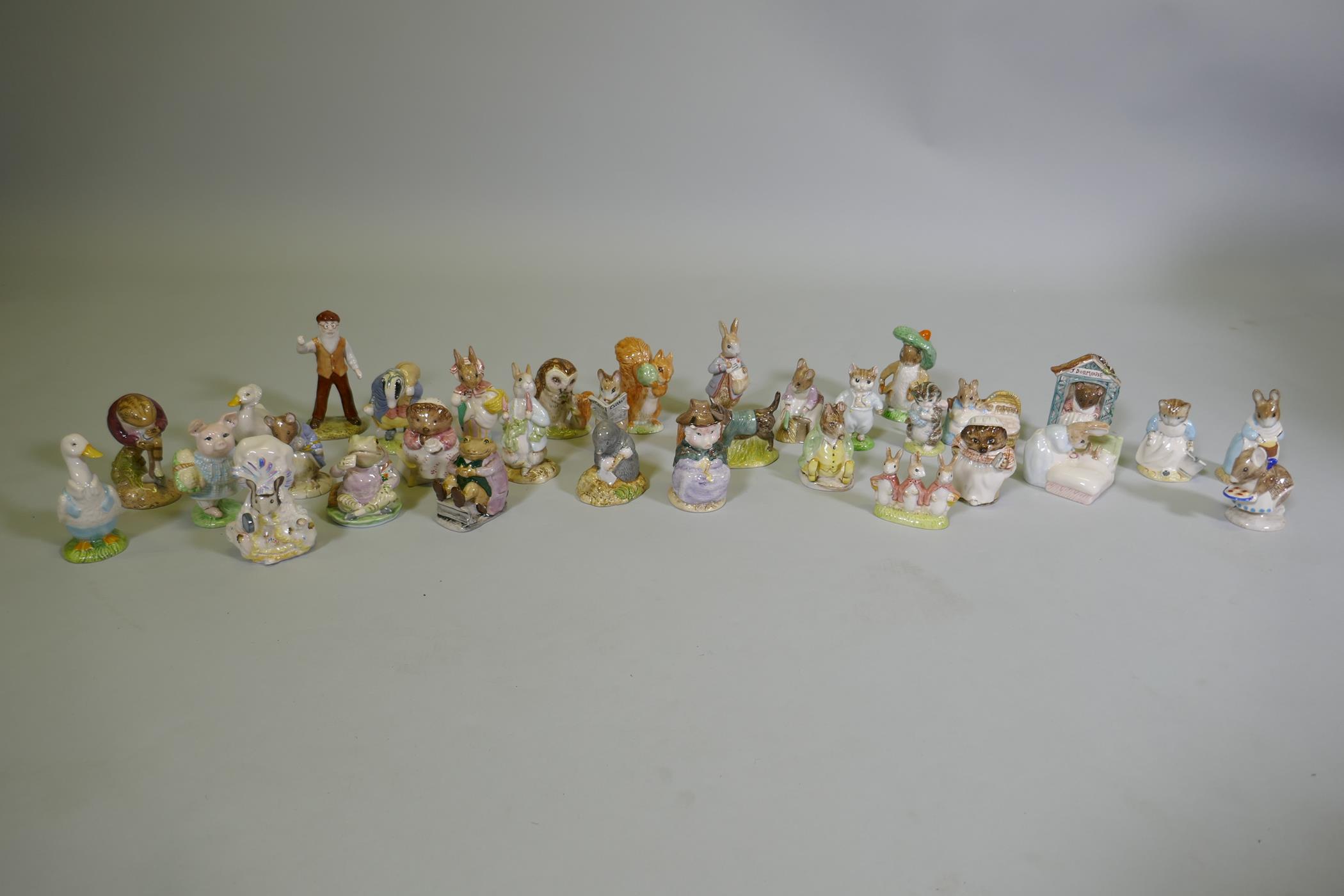 A collection of Royal Albert Beatrix Potter figurines, 33 total