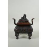 A Chinese bronze two handles censer and cover, with allover kylin decoration and lion mask feet,