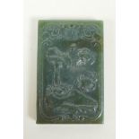 A Chinese spinach jade pendant with carved decoration of crabs and lotus flowers, 4 x 6cm