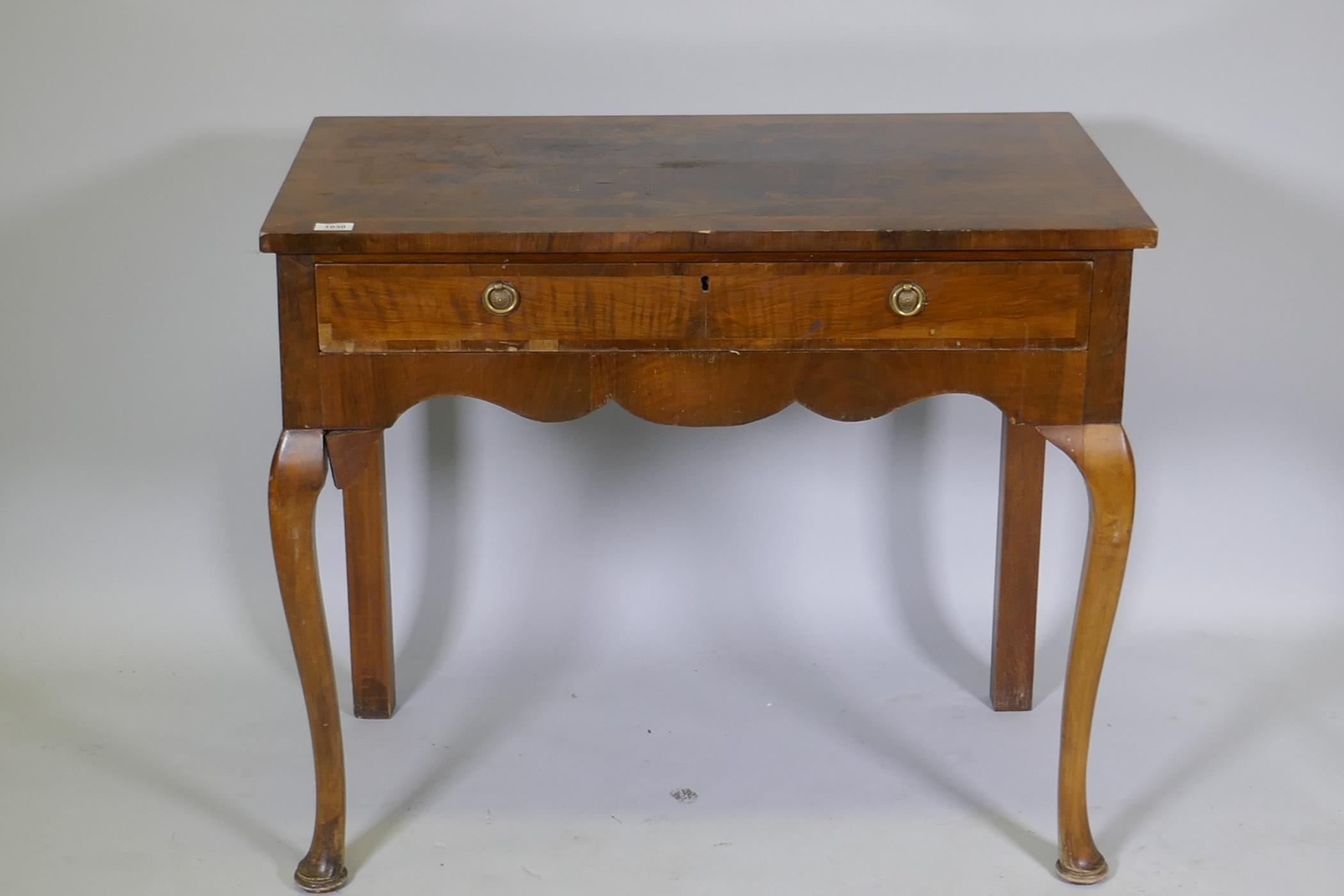 A Georgian style walnut two drawer writing table, with cross banded top, raised on cabriole - Image 2 of 5