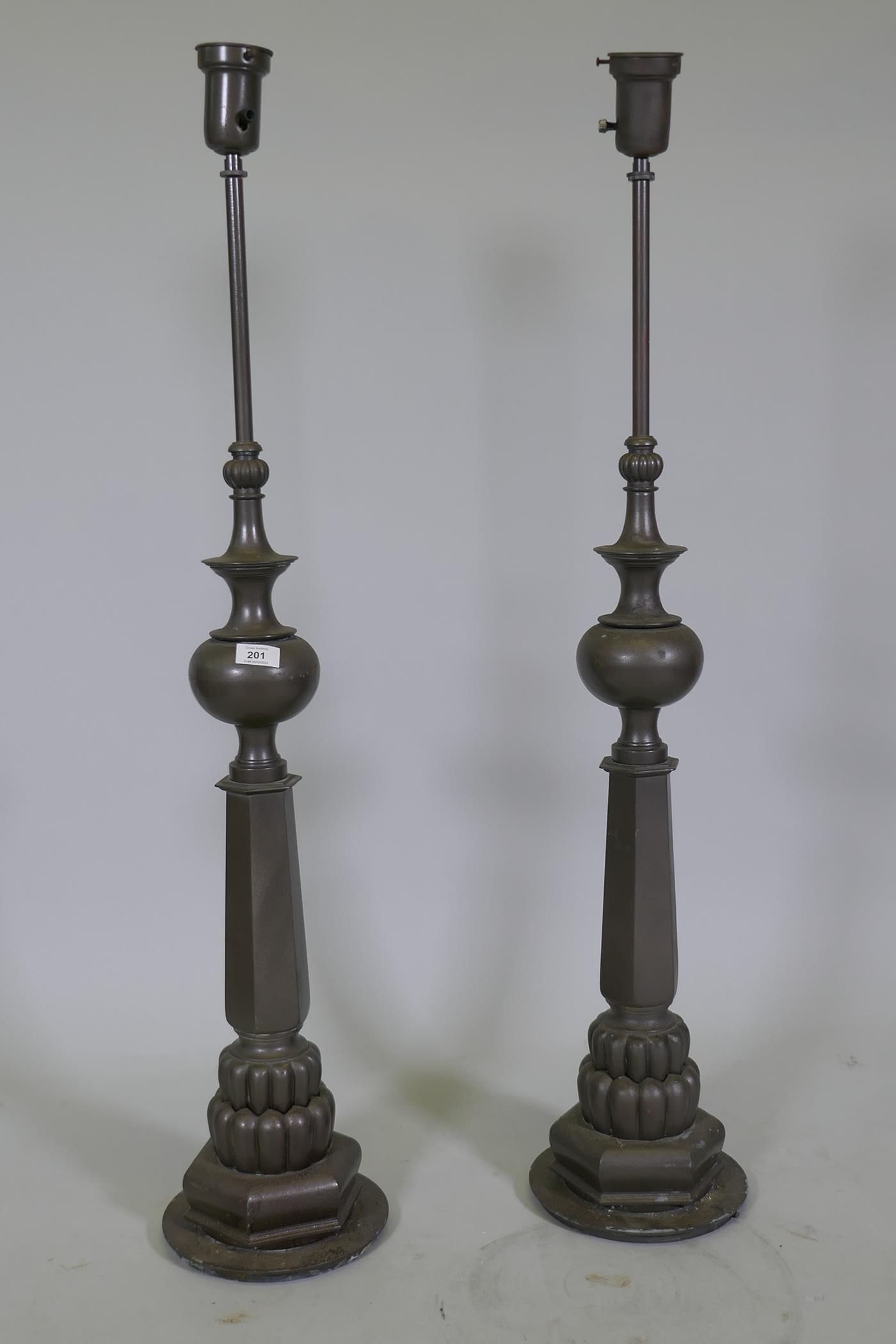 A pair of vintage metal lamps, 110cm high