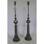 A pair of vintage metal lamps, 110cm high