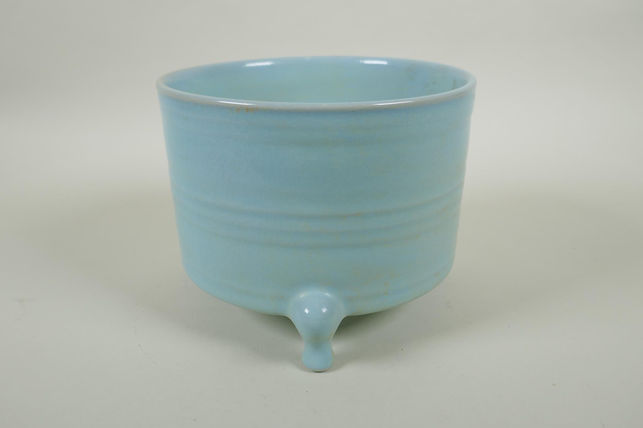 A Chinese Ru ware style ribbed censer on tripod feet, 18cm diameter