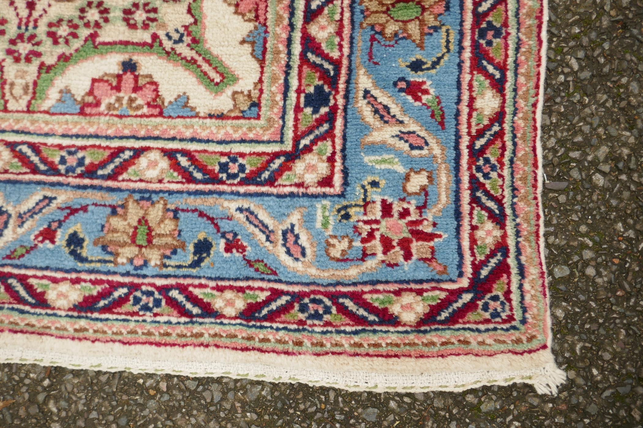 An Oriental cream ground hand woven wool runner with blue border and floral designs, 150 x 600cm - Image 3 of 4