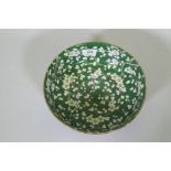 A vintage green glazed Chinese bowl with prunus blossom decoration, 24.5cm diameter