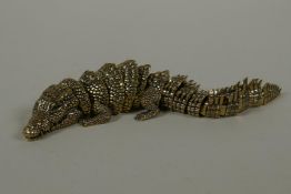 A Japanese Jizai style bronze okimono crocodile with articulated body and legs, 20cm long