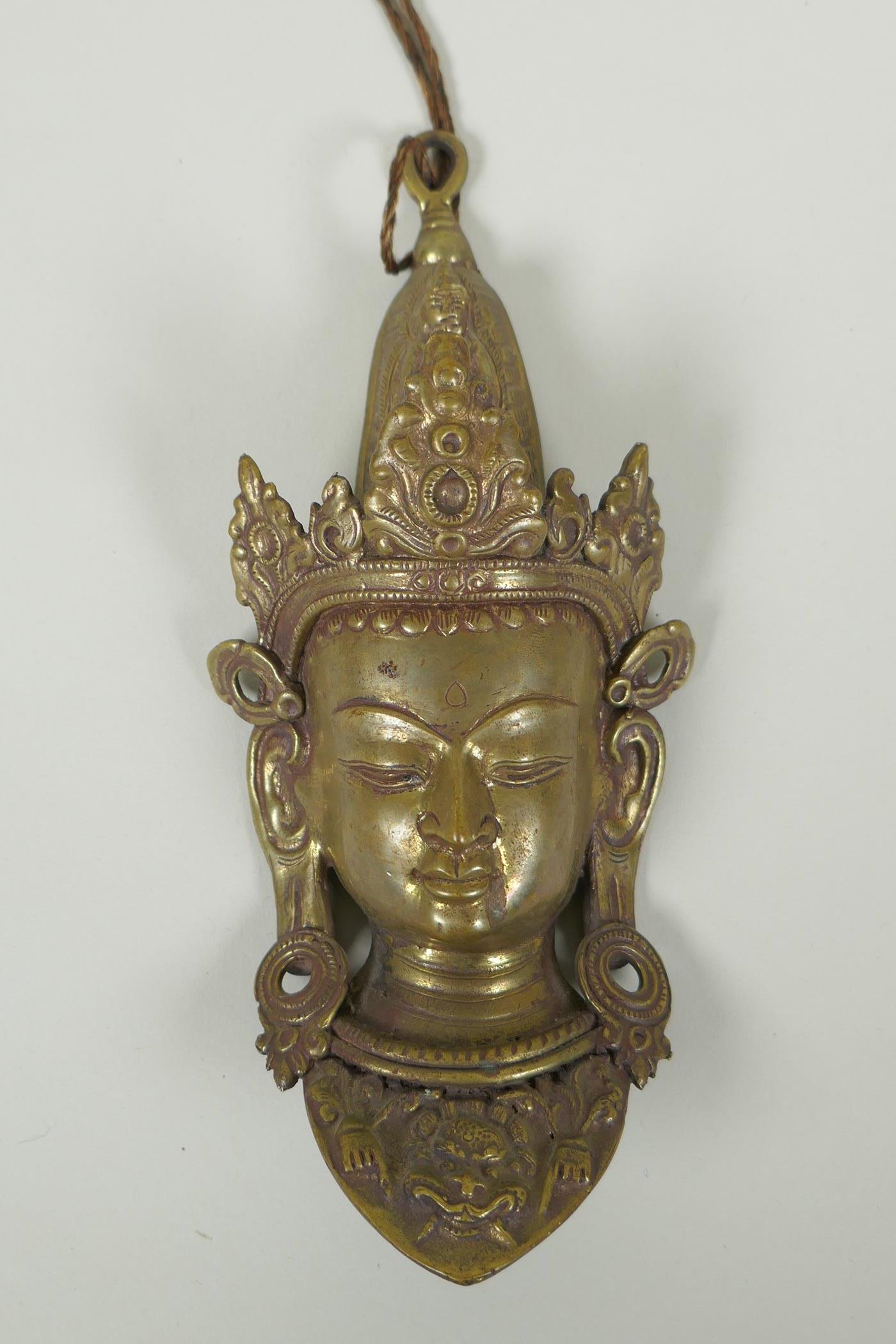 A Nepalese bronze face bust of Indra, 22cm