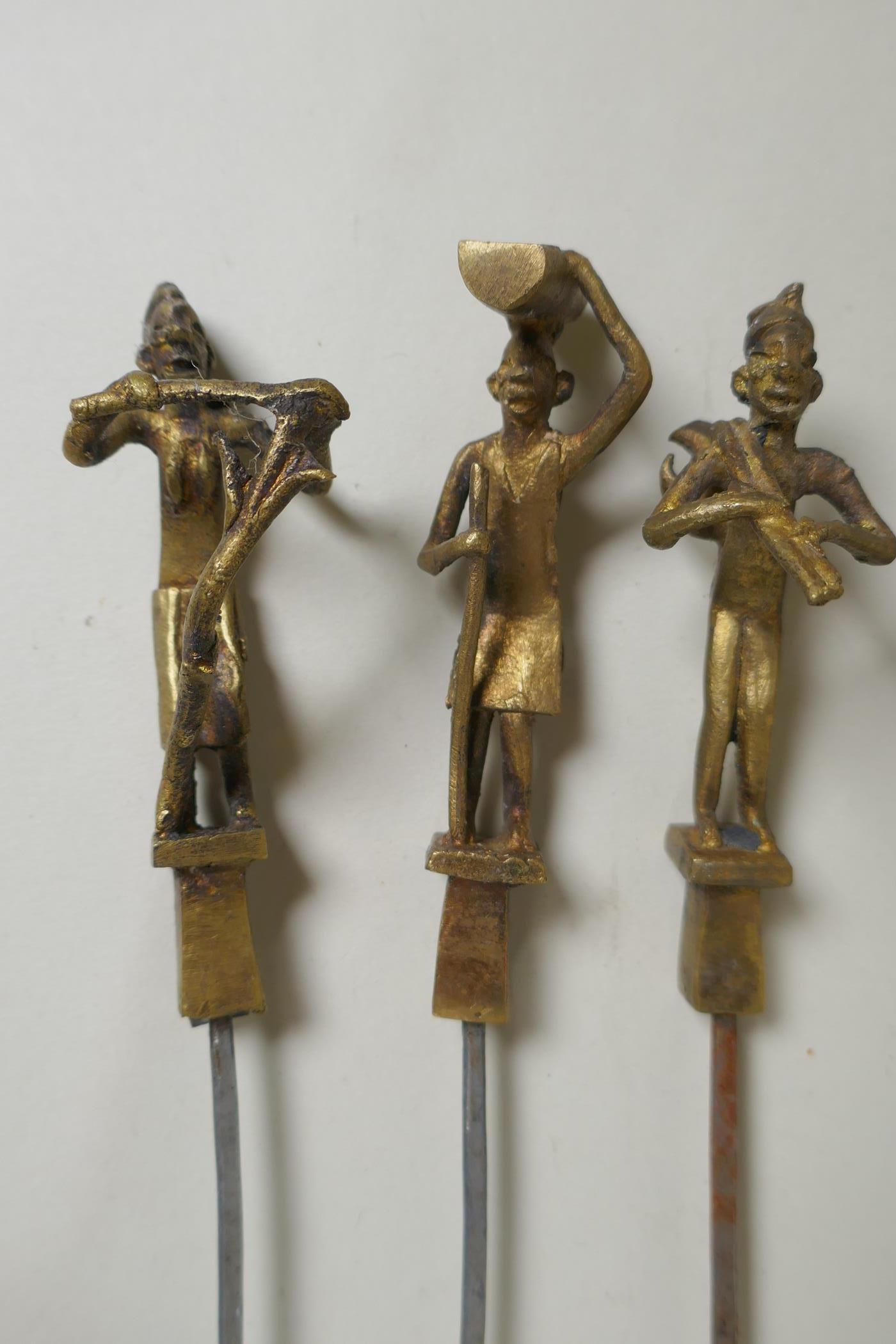 A set of six Indian gilt bronze figural skewers, 50cm long, and a pair of Islamic brass bowls - Image 4 of 6