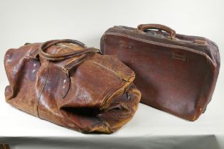 A vintage leather holdall, together with a smaller suitase