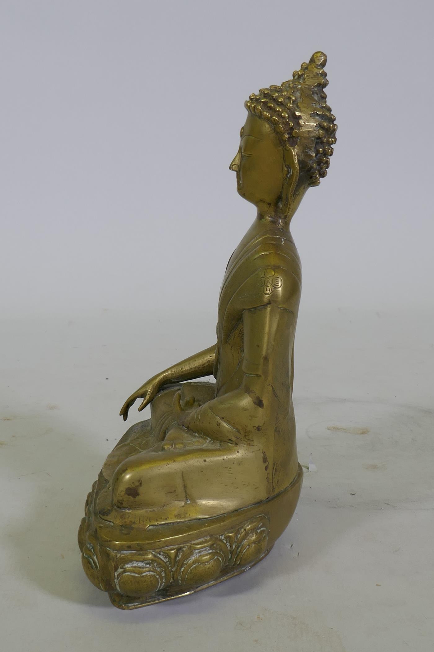 A brass figure of Buddha seated upon a lotus dias, 34cm high - Image 4 of 6