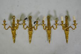 Four ormolu Louis XVI style two branch wall sconces, 44cm high