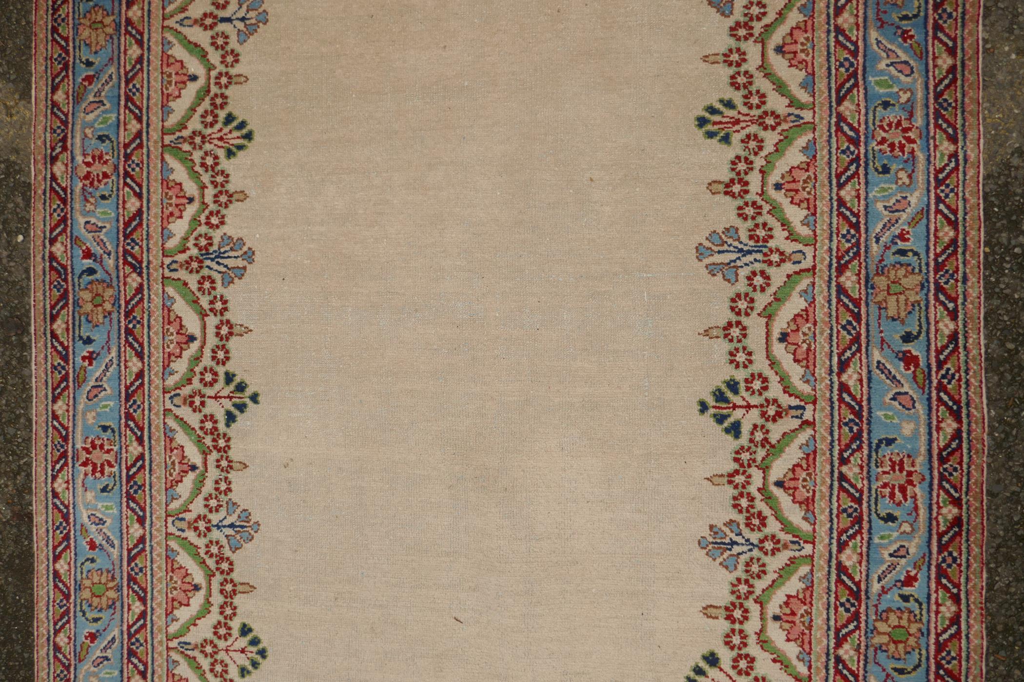 An Oriental cream ground hand woven wool runner with blue border and floral designs, 150 x 600cm - Image 2 of 4