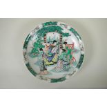 A Chinese KangXi style famille vert porcelain charger, decorated with women playing music, mark to