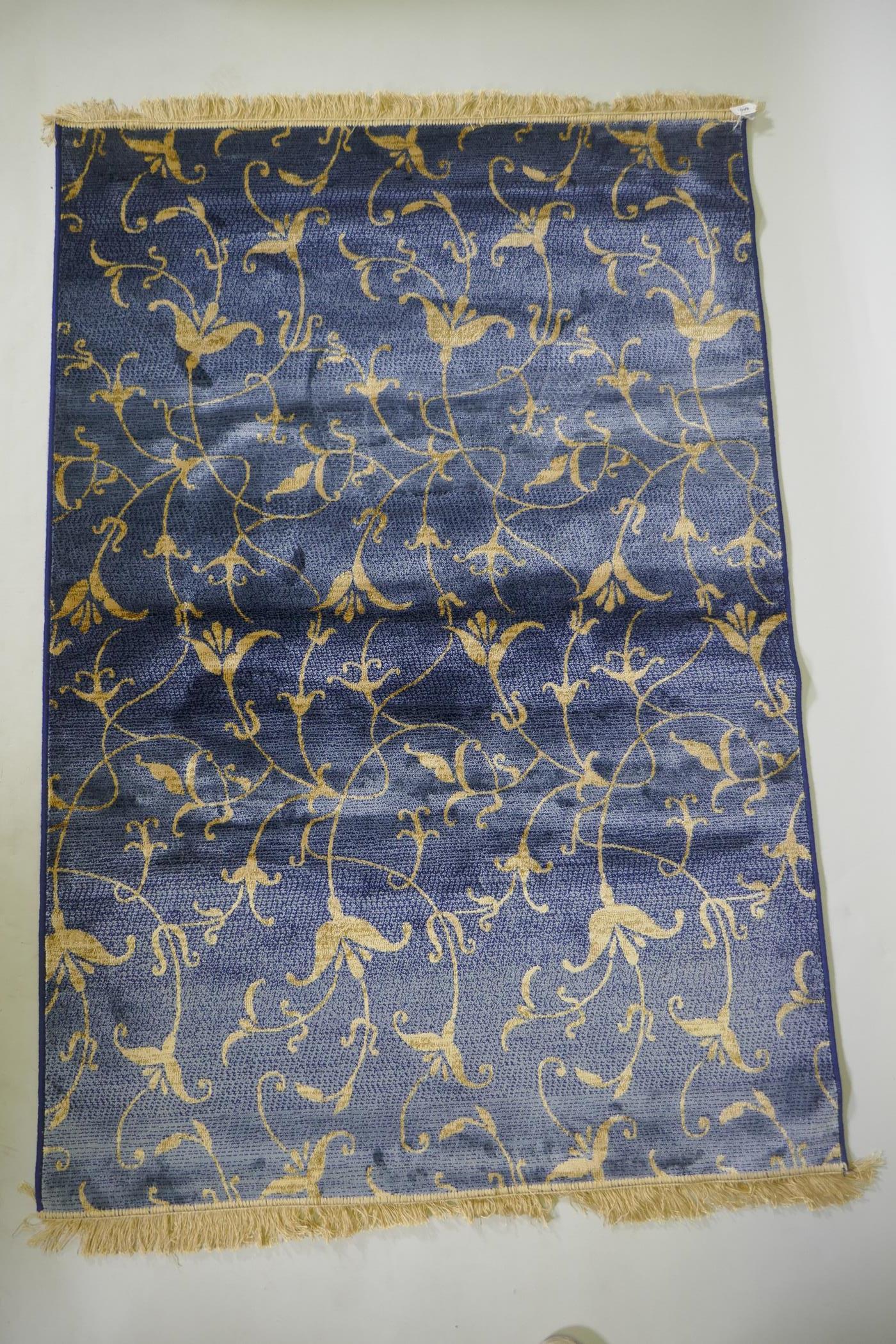 A blue ground Kashmir rug with gold scrolling floral design, 170 x 100cm - Image 2 of 4