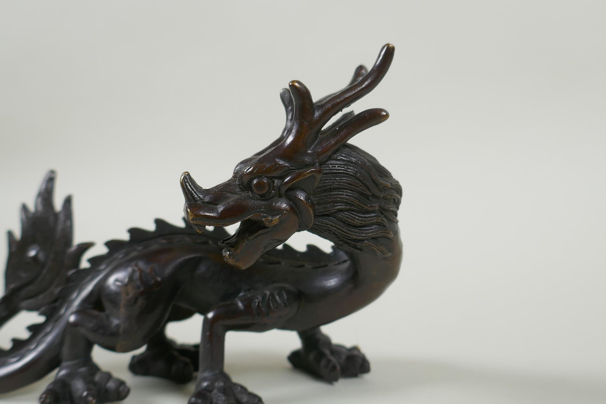 An oriental bronze figure of a dragon, 15cm long - Image 2 of 3