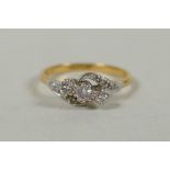 A vintage 18ct gold and platinum diamond trilogy twist ring, approx 0.3ct, size M, 2.5g gross