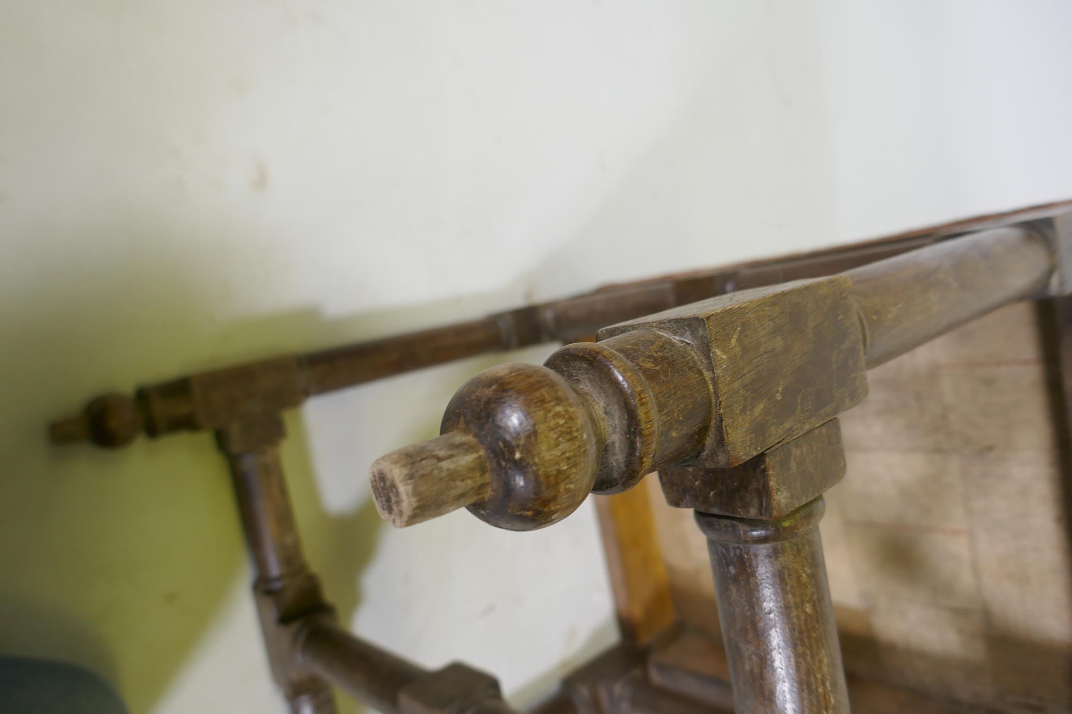 A good quality antique oak stool, raised on turned supports united by stretchers and pegged - Image 5 of 5