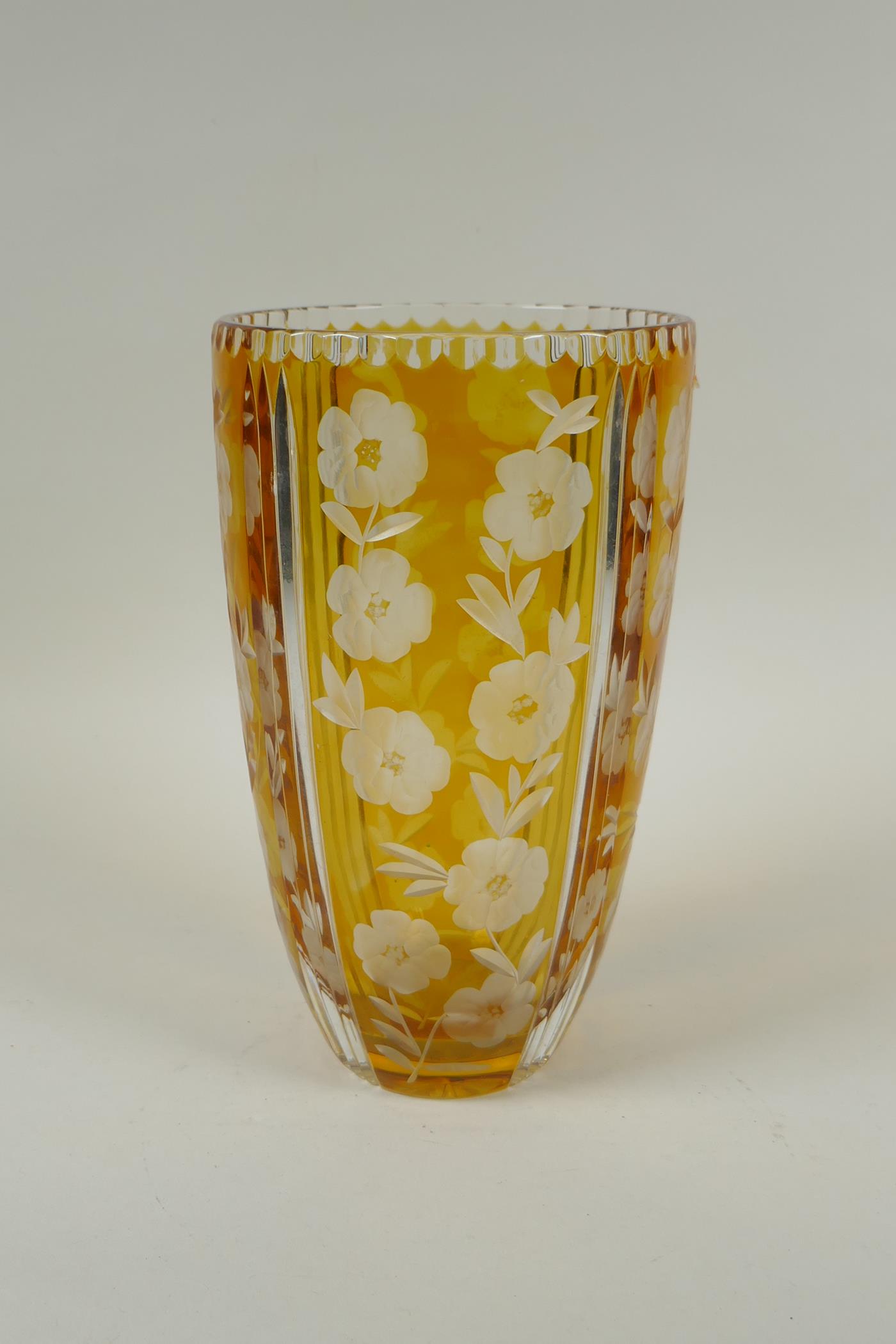 A Bohemian amber cut glass vase with floral decoration, 23cm high