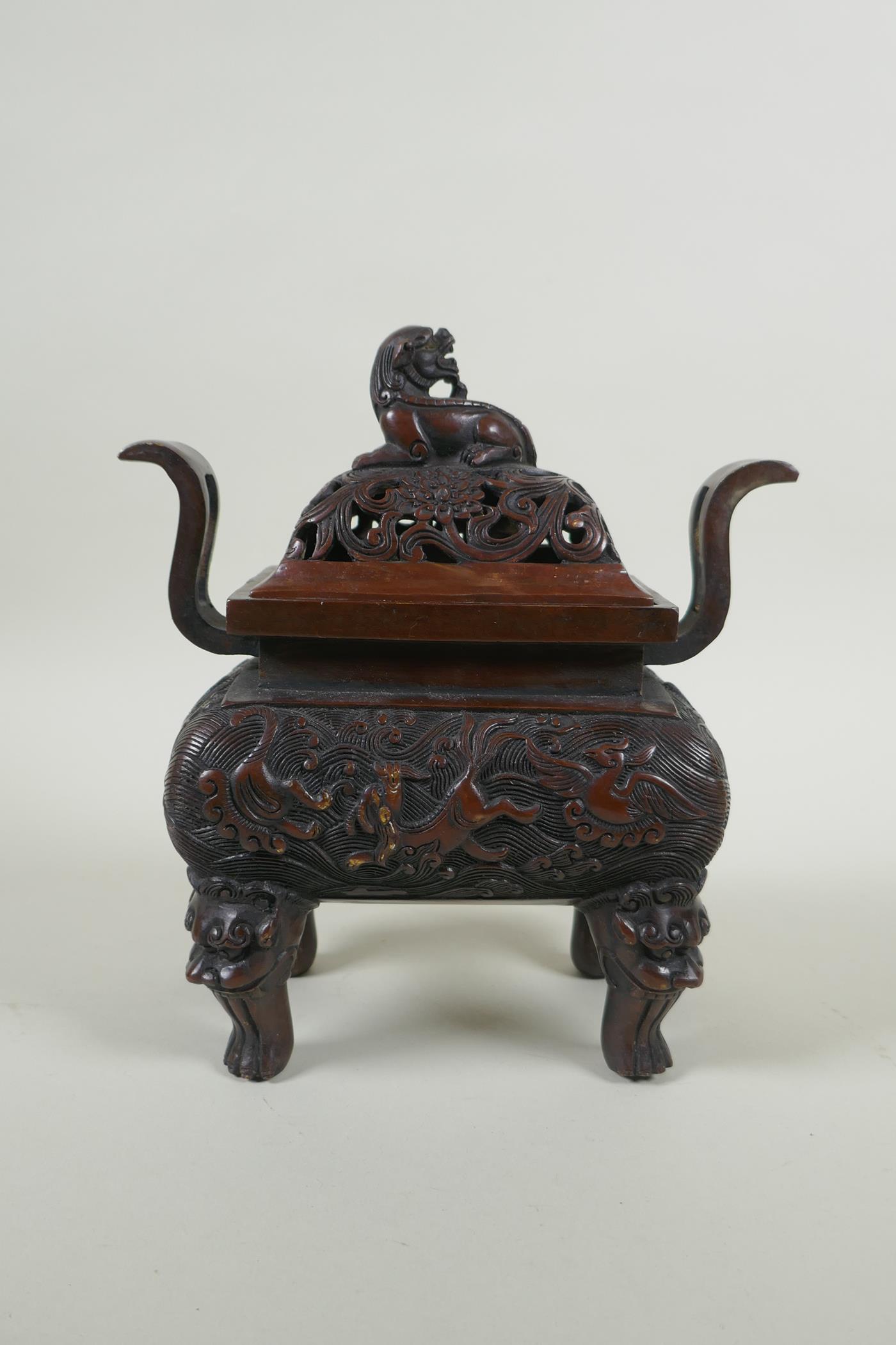 A Chinese bronze two handles censer and cover, with allover kylin decoration and lion mask feet, - Image 4 of 5