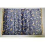 A blue ground Kashmir rug with gold scrolling floral design, 170 x 100cm