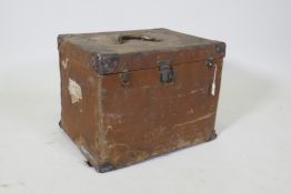 A vintage canvas travel trunk with leather mounts, 52 x 42cm, 40cm high