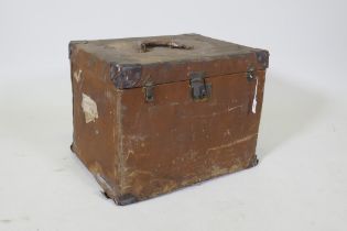 A vintage canvas travel trunk with leather mounts, 52 x 42cm, 40cm high