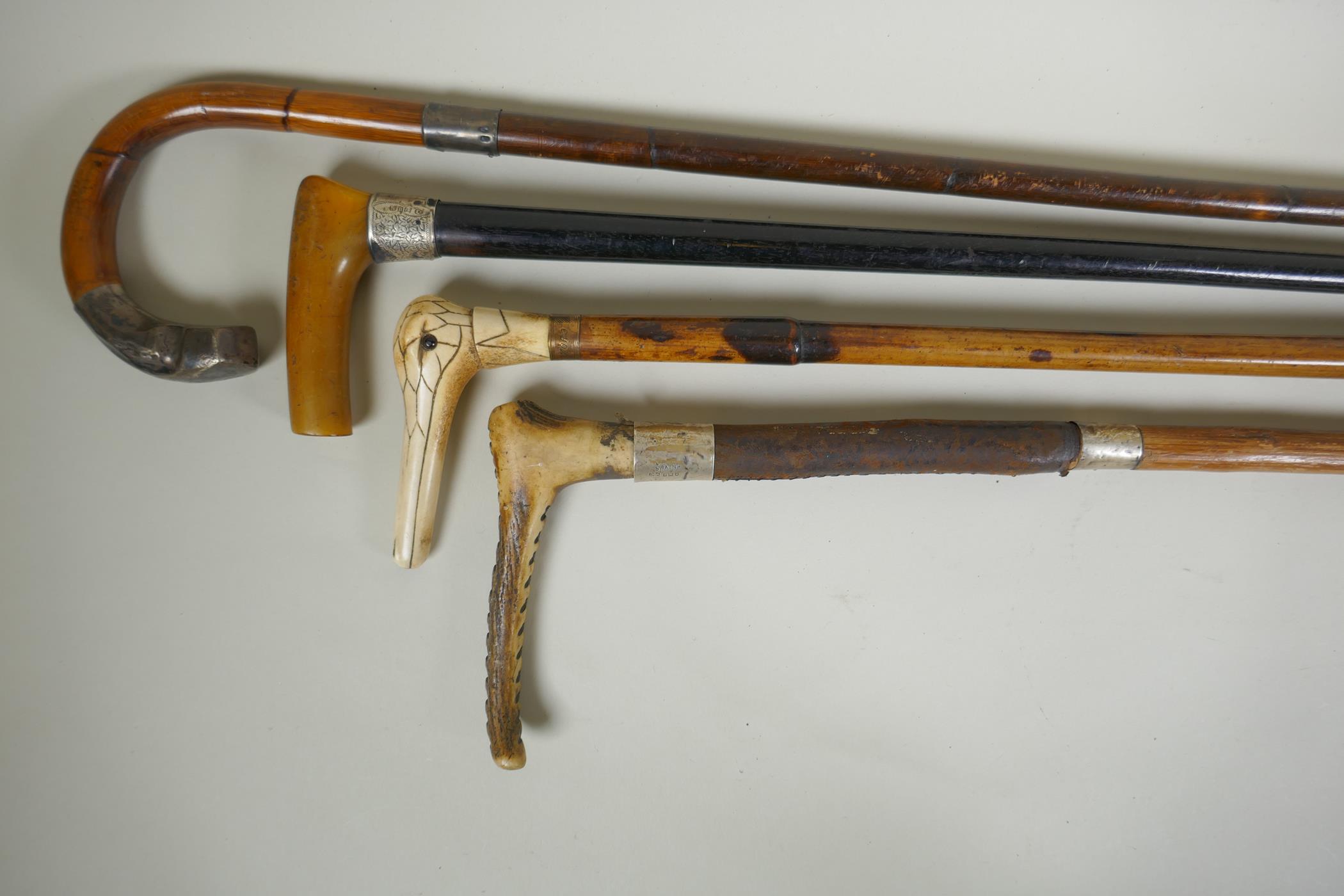 Four antique walking sticks with silver mounts and cuffs, two with carved antler handles, largest - Image 2 of 8