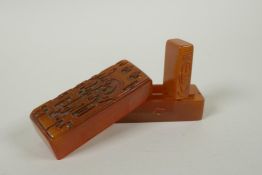 A Chinese amber soapstone seal and matching box with carved archaic dragon decorated to the cover,