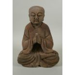 A Chinese carved and painted wood figure of Buddha, 23cm high