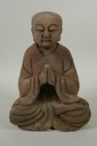 A Chinese carved and painted wood figure of Buddha, 23cm high