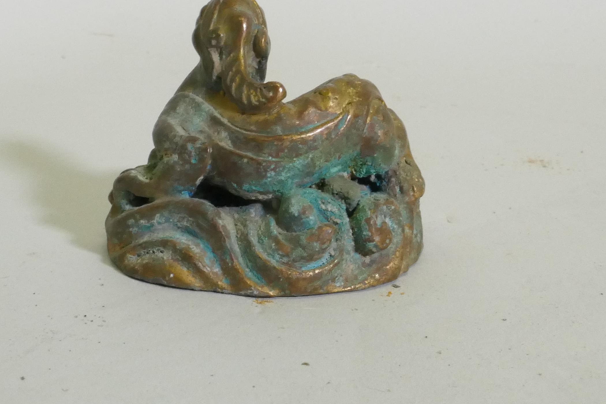 An Eastern bronze figure of a horned dragon, 5cm high - Image 4 of 4