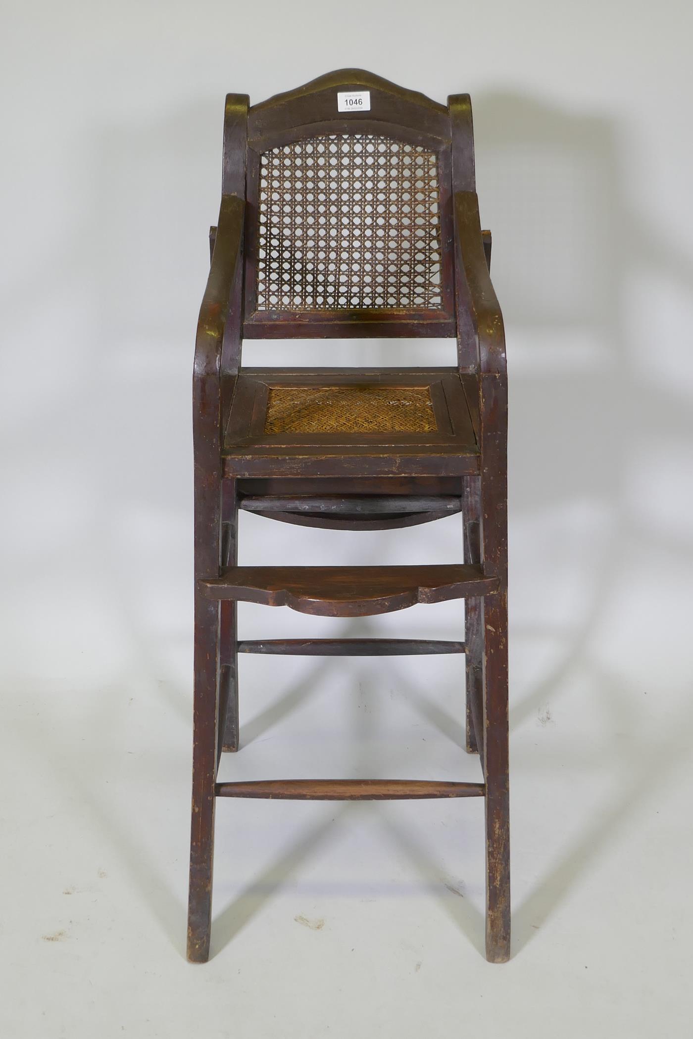 An oriental hardwood child's highchair with can back and seat, 103cm high - Image 3 of 4