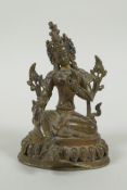 A Tibetan bronze figure of Green Tara with inset turquoise beads, inscription verso, 12cm high