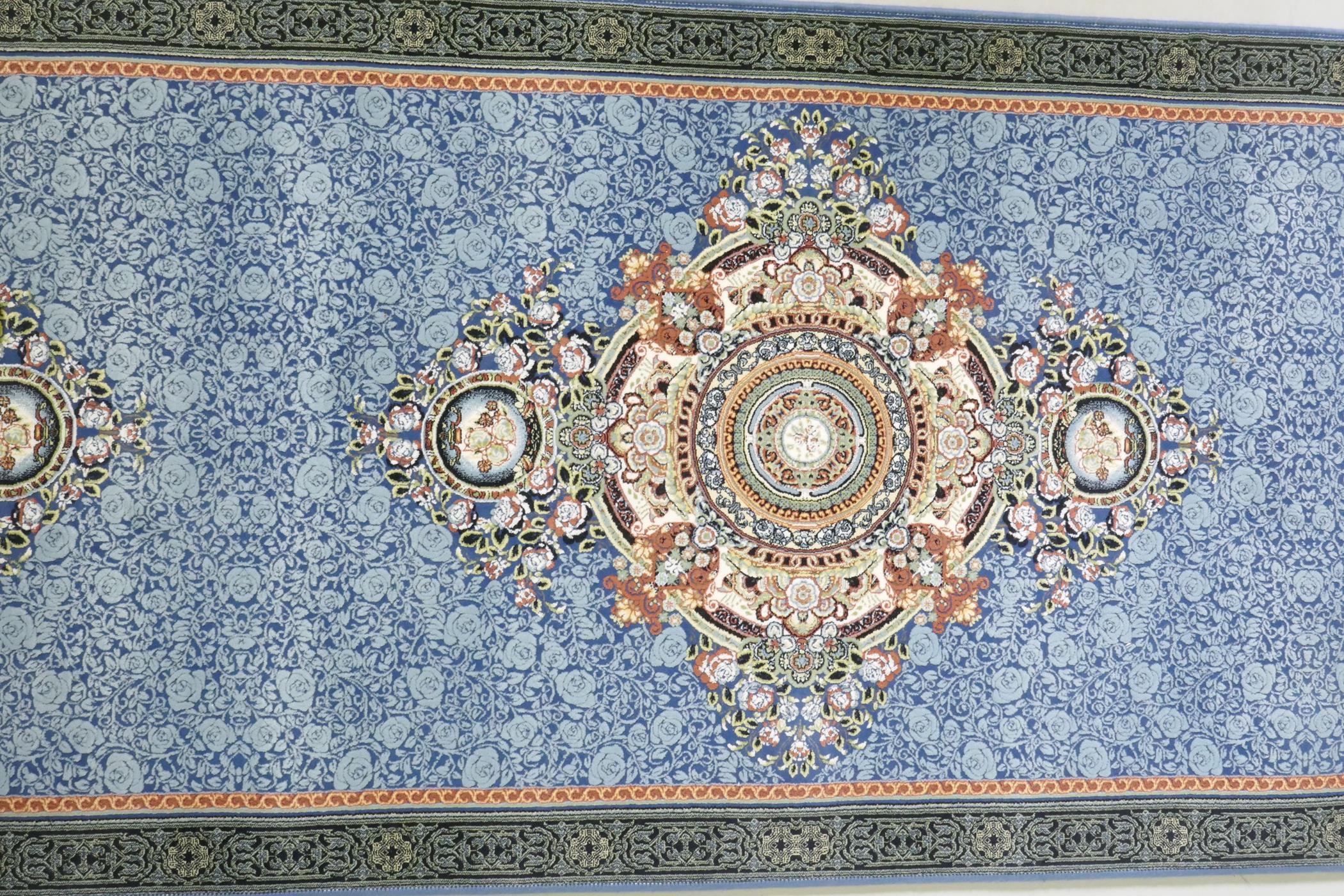 An Iranian fine woven blue ground runner with a medallion design and darker blue border, 80 x 310cm - Image 3 of 5