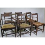 A pair of Regency mahogany bar back elbow chairs with reeded decoration and four similar standard