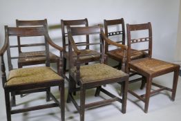 A pair of Regency mahogany bar back elbow chairs with reeded decoration and four similar standard