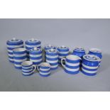 A quantity of Cornish ware pottery, three T&G Green jars and covers and a milk jug, the remainder by