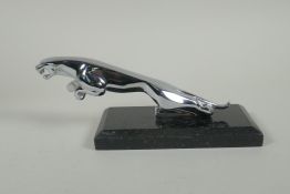 A chromed metal 'Jaguar' style car mascot, on a display stand, 20cm long