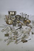 A quantity of silver plate, entree dishes, candlestick and flatware