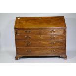 A Georgian mahogany bureau, the fall front with inset leather opening to reveal a fitted interior