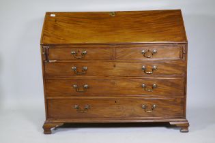 A Georgian mahogany bureau, the fall front with inset leather opening to reveal a fitted interior