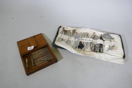 A wood case stamped Weiss & Son, London, containing surgical instruments, and another fold out