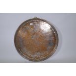 A Middle Eastern silver plated on heavy gauge copper tray/wall plaque, plate rubbed