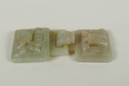 A Chinese carved celadon jade belt buckle with dragon and phoenix decoration